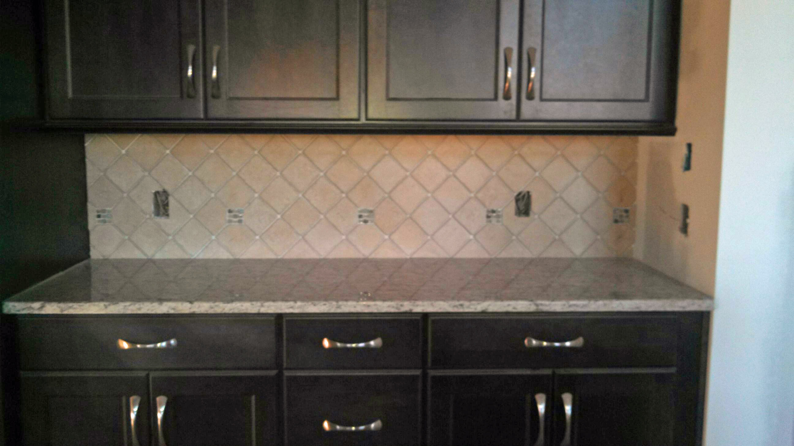 Tile backsplash dark cabinets | Grace Construction, Inc.